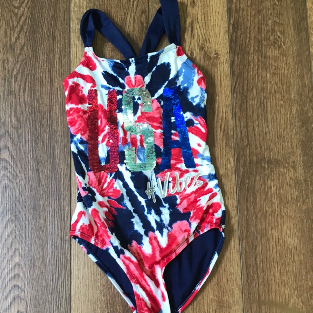 A red,white,and blue flip sequin Justice one piece swimsuit